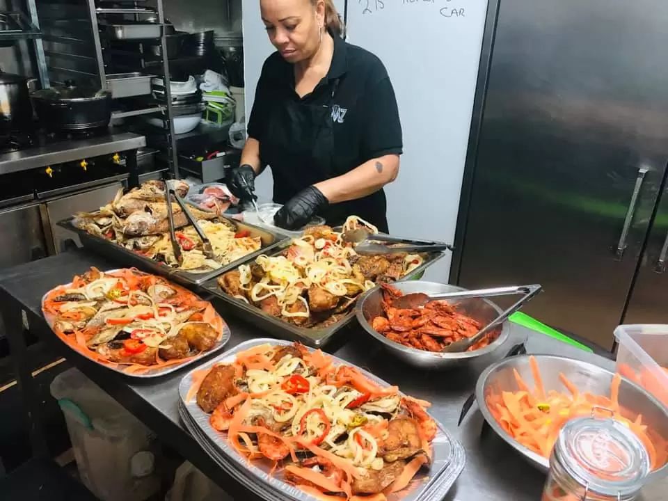 Jemz team preparing Caribbean catering platters for a special occasion in Bedford