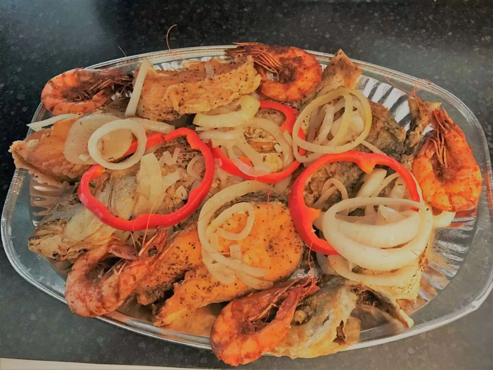Caribbean seafood platter with king prawns, onions and peppers Jemz Caribbean Café Bedford