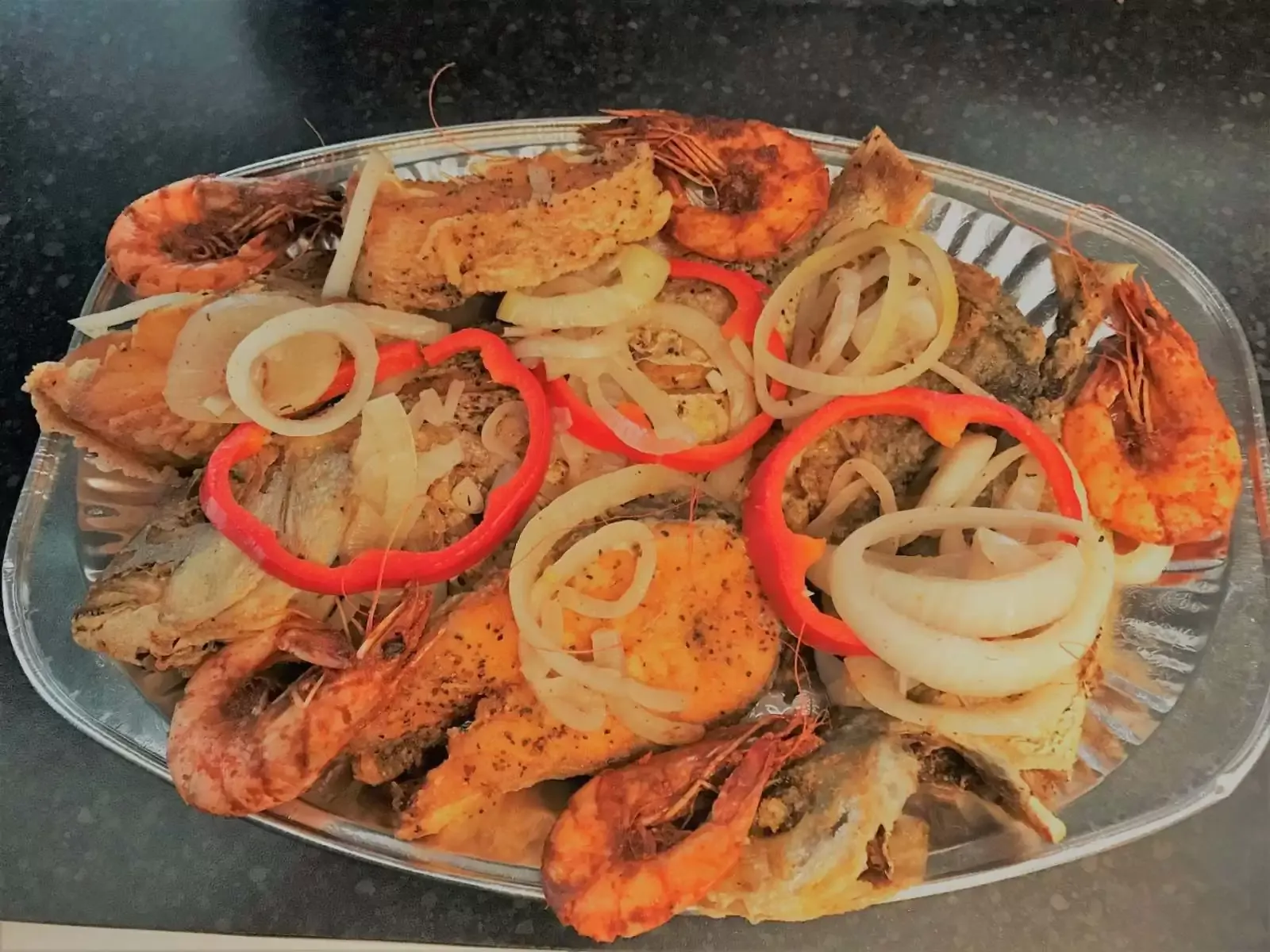 Caribbean seafood platter with king prawns, onions and peppers Jemz Caribbean Café Bedford