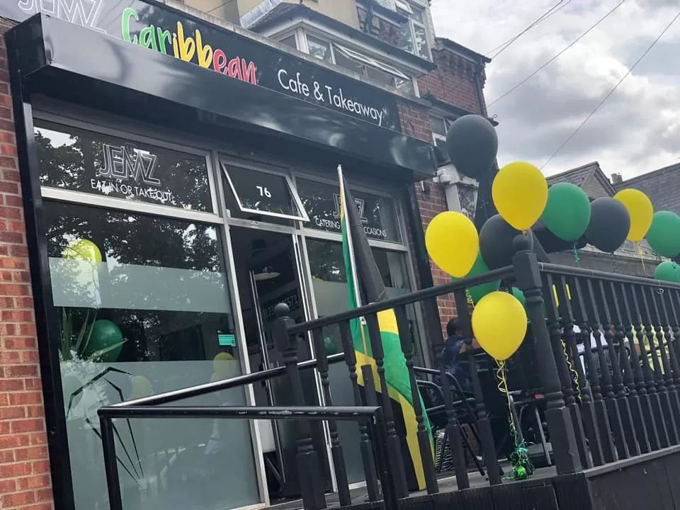Jemz Caribbean Café shop front decorated with balloons in Bedford